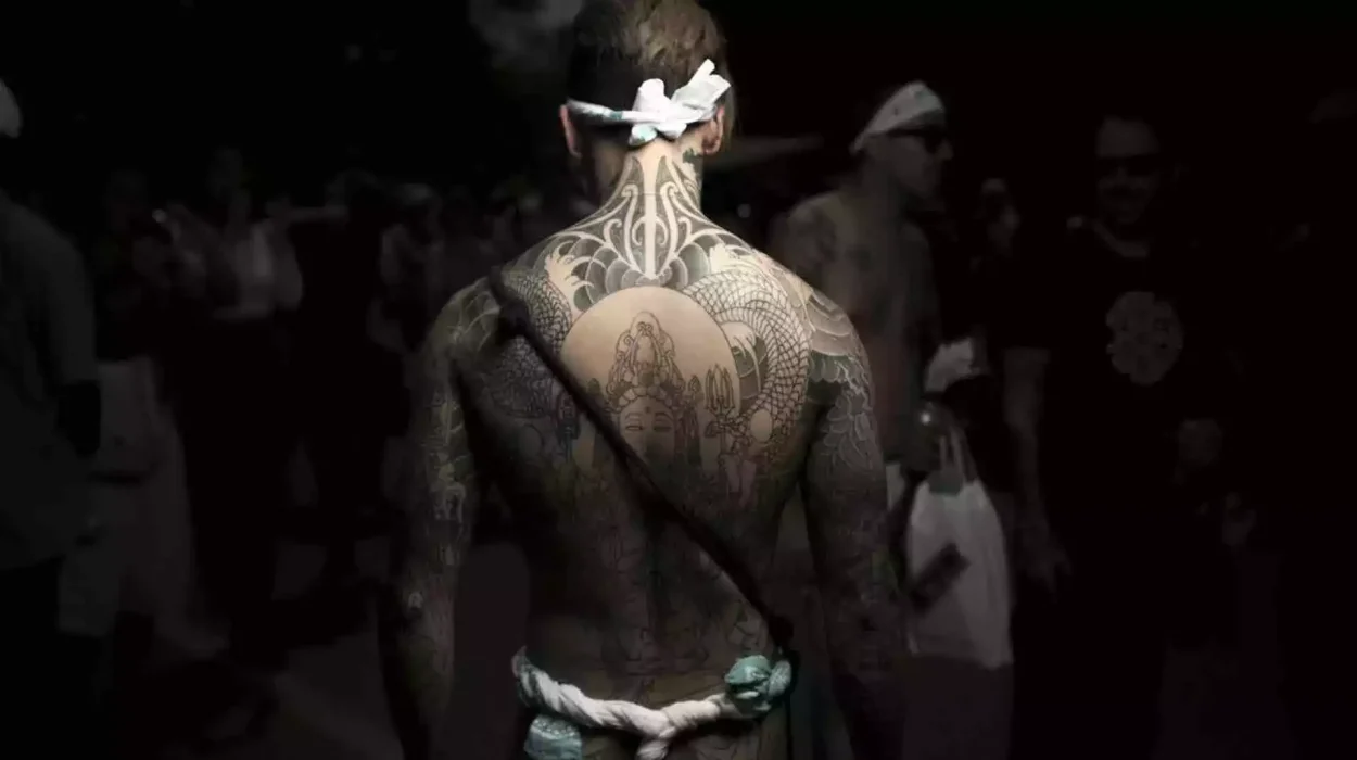 Large back tattoo featuring a central figure surrounded by detailed patterns